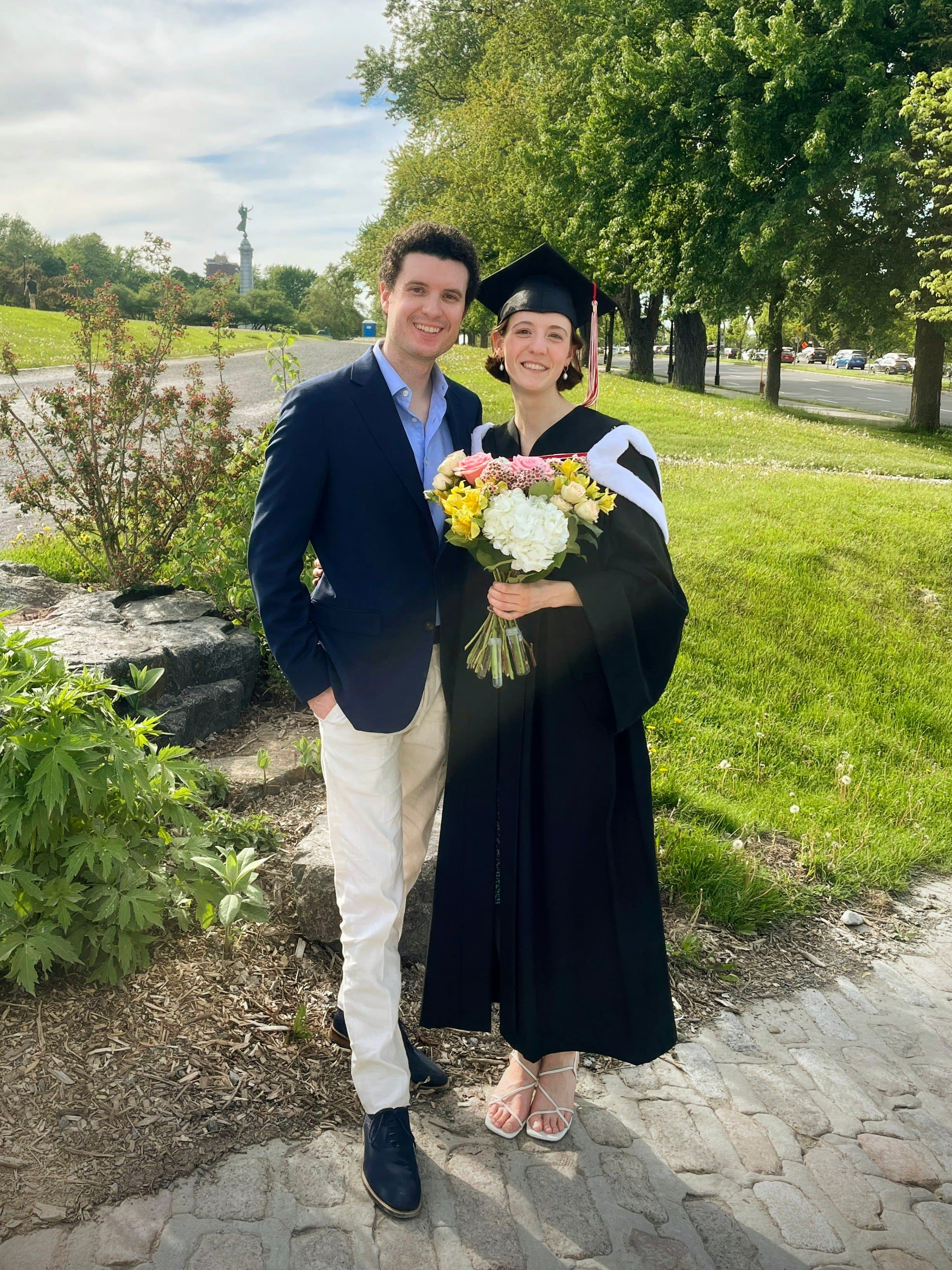 Seb and Raina with a bouquet of flowers
